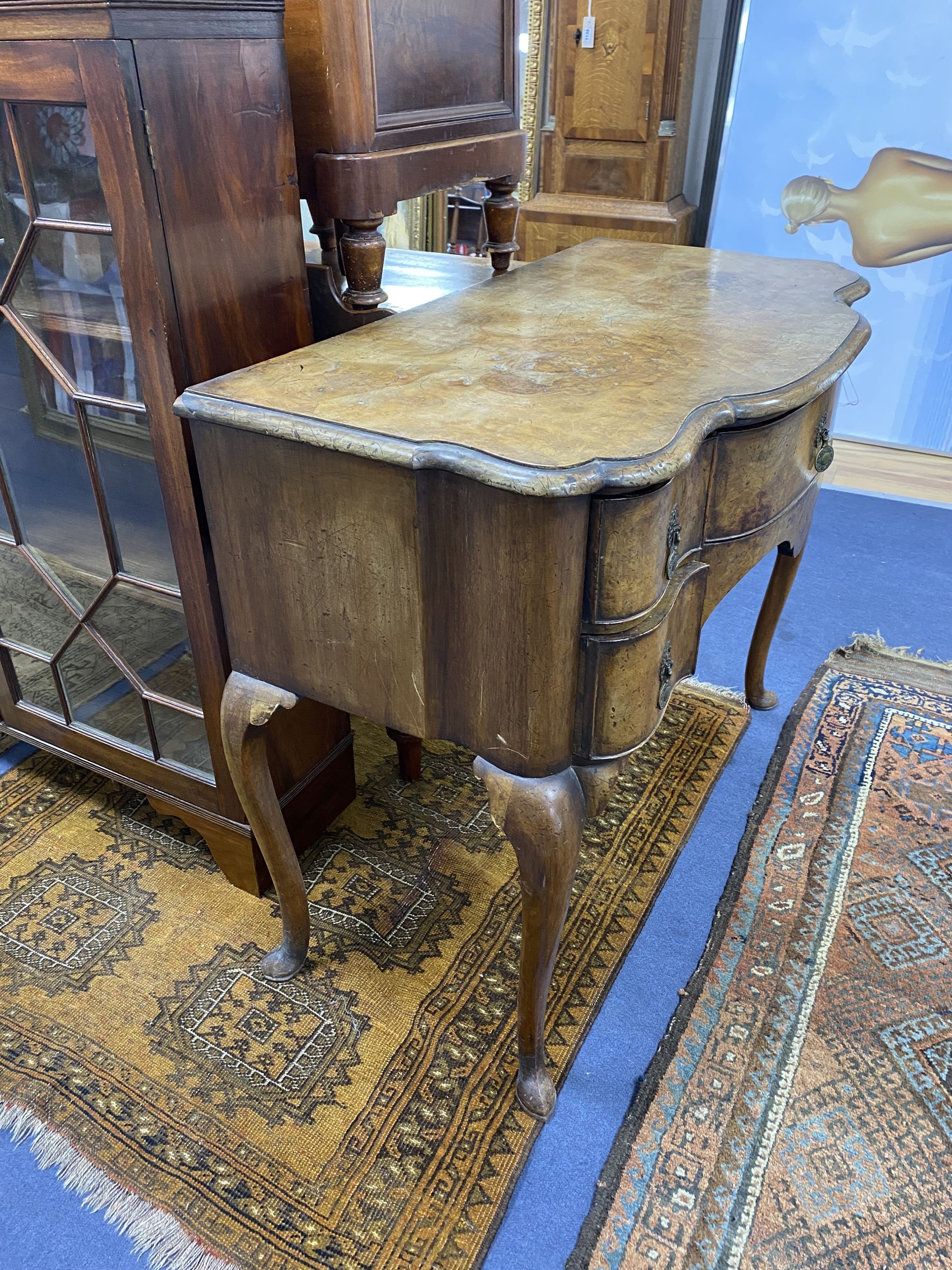 An 18th century style Dutch walnut bow front side table, width 91cm, depth 49cm, height 76cm